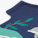 A close up of Frugi Bonnie Dress in Navy Blue's folded sleeve.