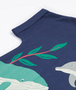 A close up of Frugi Bonnie Dress in Navy Blue's folded sleeve.