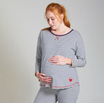 Woman modelling the Frugi long sleeve navy breton striped maternity and nursing pyjama top