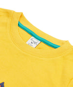 Close up of the Frugi kids bumblebee okapi short sleeve t-shirt. showing the yellow neck trim and green trim on the inside of the neck on yellow organic cotton fabric