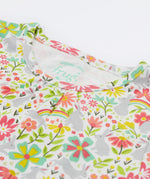Close up of the Frugi bunny bounce fawn pyjama set showing the neck trim and the grey bunny with floral print design on organic cotton fabric