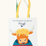 Frugi canvas tote bag in soft white with one yellow and one green strap and a highland coo cow design on the front.