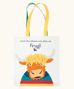 Frugi canvas tote bag in soft white with one yellow and one green strap and a highland coo cow design on the front.