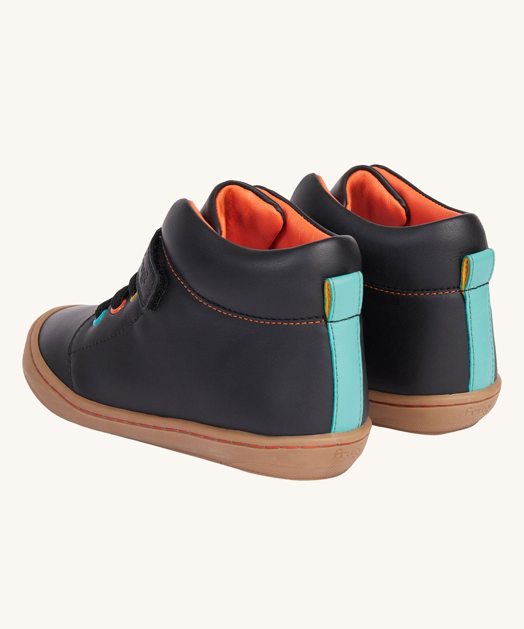 A view of the back of the Frugi cape stretch children's lace boot in black leather with salamander orange leather lining. The boots have a blue  coloured leather strip on the back.