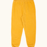 Frugi carne organic cotton cord pull up trousers in bumblebee yellow with soft cotton waistband and cuffs that can be folded down for extended wear.
