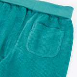 Close up of the back pocket on the  Frugi carne organic cotton cord pull up trousers in hut green.