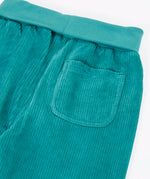 Close up of the back pocket on the  Frugi carne organic cotton cord pull up trousers in hut green.