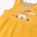 Frugi GOTS 100% organic cotton reversible dungarees in yellow corduroy with a cute highland cottage applique on the front and popper fasteners on the shoulders straps