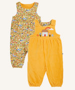 Frugi catrin reversible dungarees bumble yellow highland houses. One side is a bumble yellow corduroy with highland house applique on the front, the other side features an all over highland house print.