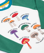 A close up of the mushrooms on teh front of the Frugi Children's Organic Ace Applique Top - White / Mushrooms