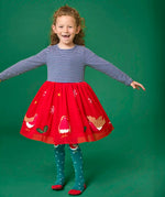 Child wearing the Frugi emmie skater dress with a long sleeved navy stripe top half and red robin applique skirt twirling around.
