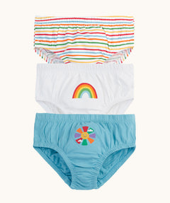 Frugi children's organic cotton pants 3 pack multipack with three different rainbow themed designs. A rainbow striped briefs, a white pair with a small rainbow on the front and a blue pair with a sun with rainbow coloured rays. 