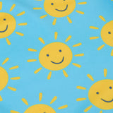 A close up of the smiley sunshine print on the Frugi blue children's tankini. A short sleeved swimwear top with matching brief style bottoms.