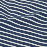 Close up of the material of the Frugi childs organic cotton navy breton stripe leona leggings.