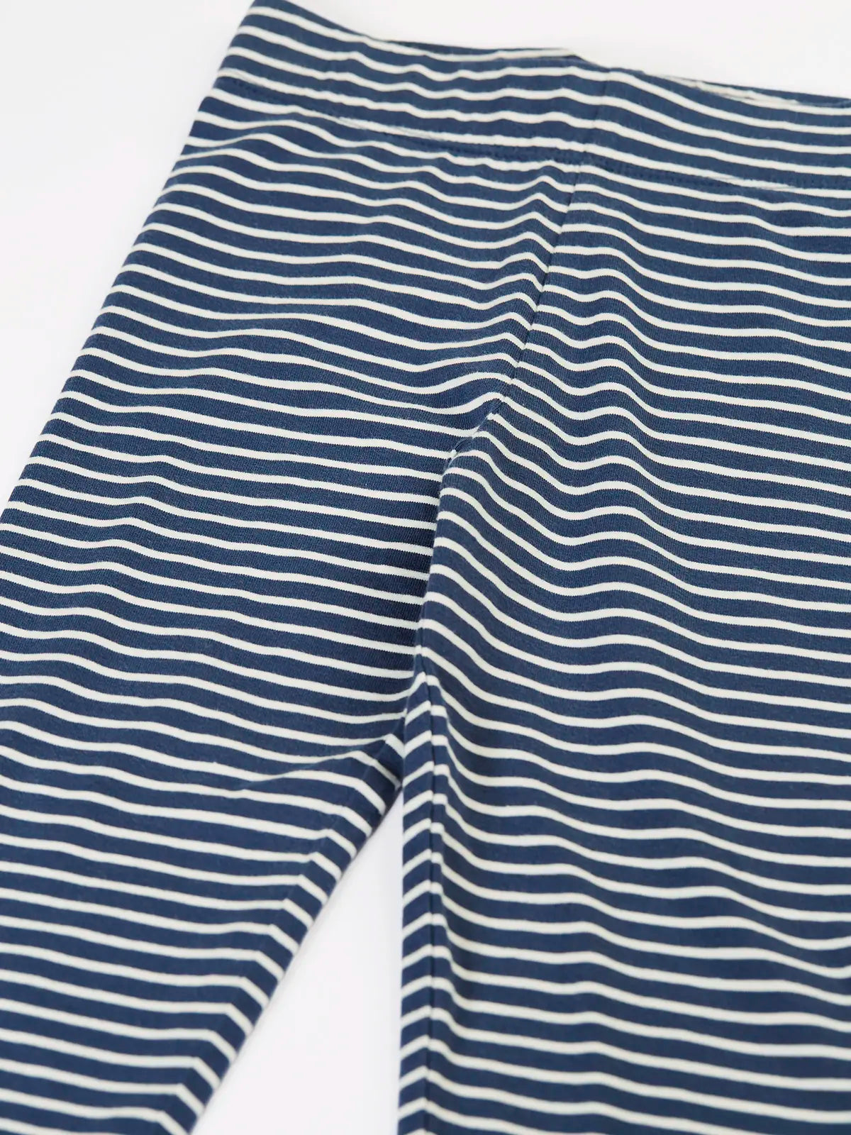 Close up of the Frugi childs organic cotton navy breton stripe leona leggings.