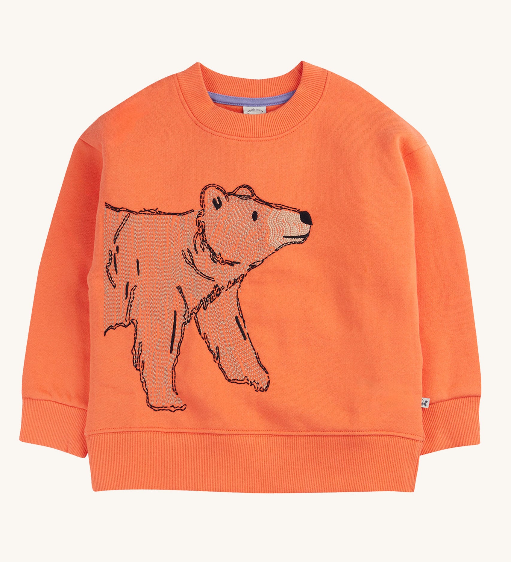 A Frugi organic cotton Superb Stitched bear sweatshirt. The embroidered bear design is on a salamander orange coloured background. 