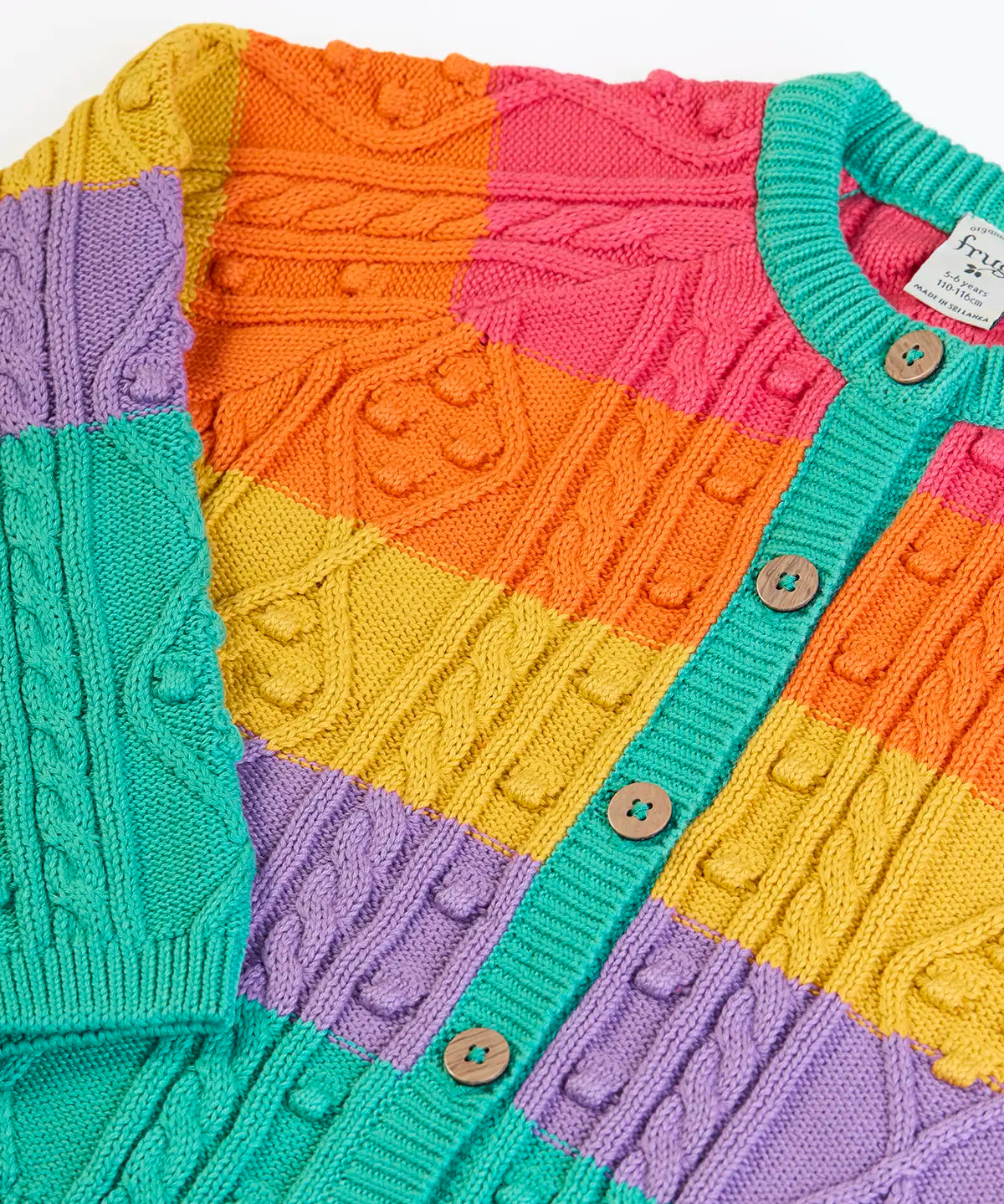 Front of the Frugi clay cable knit cardigan rainbow stripe organic cotton with button closure front.