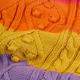 Close up of cable knit on the Frugi clay cable knit cardigan rainbow stripe organic cotton.