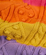 Close up of cable knit on the Frugi clay cable knit cardigan rainbow stripe organic cotton.