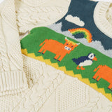 Close up of the highland cow and puffin design on the front of the Frugi clyde cable knit organic cotton jumper.