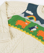 Close up of the highland cow and puffin design on the front of the Frugi clyde cable knit organic cotton jumper.