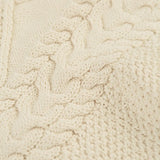Close up of the natural cream coloured knit on the Frugi clyde cable knit organic cotton jumper.
