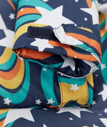 A close up of the arm cuff on the Frugi playtime magic stars coat showing the velcro detail for size adjusting.