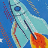Frugi layered long sleeve top showing close up of a rocket applique on cobalt blue organic cotton fabric