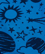 Close up of the blue monochrome space print on one side of the Frugi Gylly cord reversible children's dungaree.