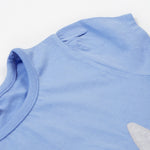 Close up of the Frugi kids cornflower blue rabbit appliqué t-shirt. Showing the short sleeve detail on light blue organic cotton fabric