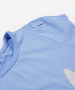 Close up of the Frugi kids cornflower blue rabbit appliqué t-shirt. Showing the short sleeve detail on light blue organic cotton fabric