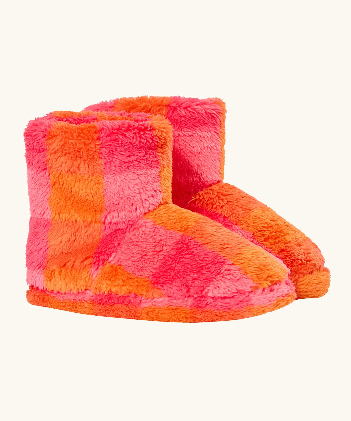 A pair of frugi plush, fuzzy ankle slippers in a bright orange and pink checkerboard pattern.