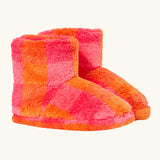 A pair of frugi plush, fuzzy ankle slippers in a bright orange and pink checkerboard pattern.