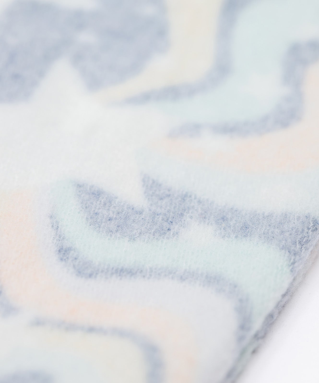 A close up of the Brushback Fleece inside the Frugi Magic Skies Organic Cotton Cosy Flared Leggings. These warm cotton leggings are lined with a Brushback Fleece surface inside. These leggings are part of a wide range of organic cotton clothing for children available here at Babipur. 
