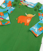 Frugi GOTS organic cotton green dungarees outfit with a cute highland cow applique on the front with adjustable shoulder straps and a light blue top underneath 
