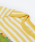 Close up of the Frugi kids crocodile rue romper. Showing the shoulder detail on yellow and white striped organic cotton fabric