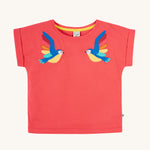 Frugi Daisy Applique T-Shirt in Watermelon, featuring two embroidered parrots on either side.