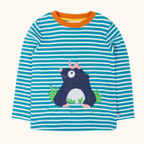 Frugi discovery long sleeve top in a boat blue Breton stripe with a mole applique on the front with a worm on it's head.