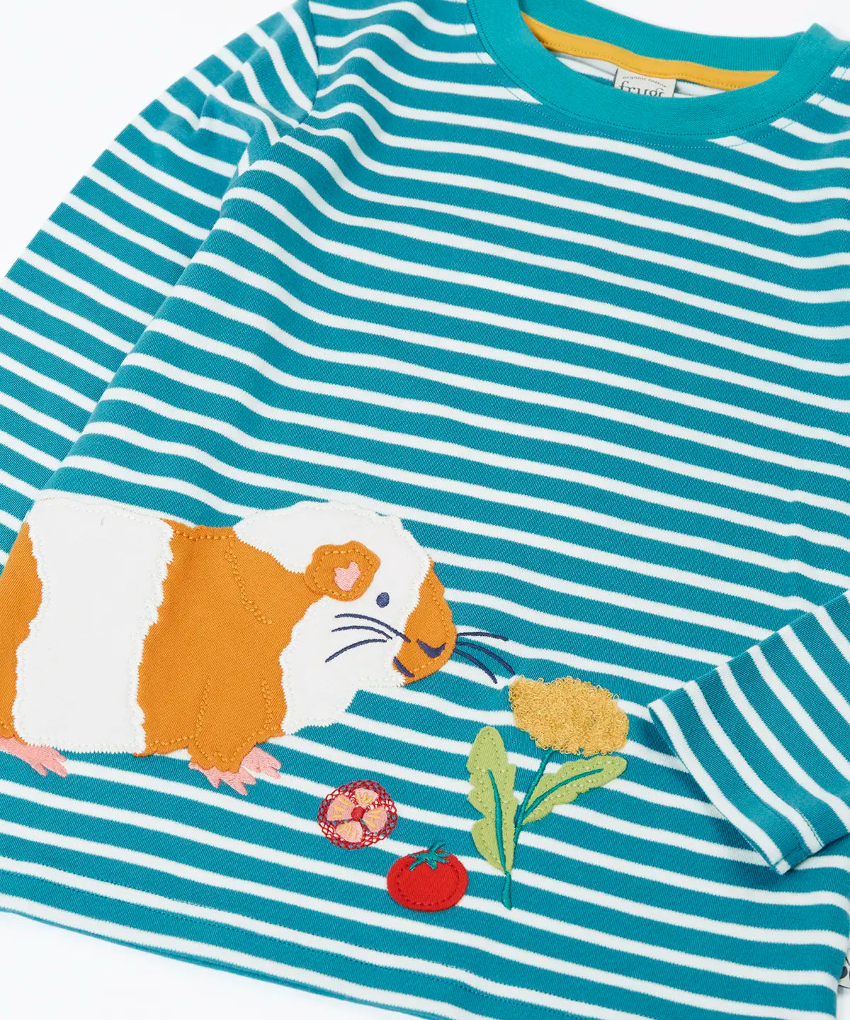 Close up of the guinea pig applique and details on the front of the Frugi discovery circular cotton long sleeve top in boat blue Breton stripe.