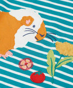 Close up of the guinea pig applique and details on the front of the Frugi discovery circular cotton long sleeve top in boat blue Breton stripe.