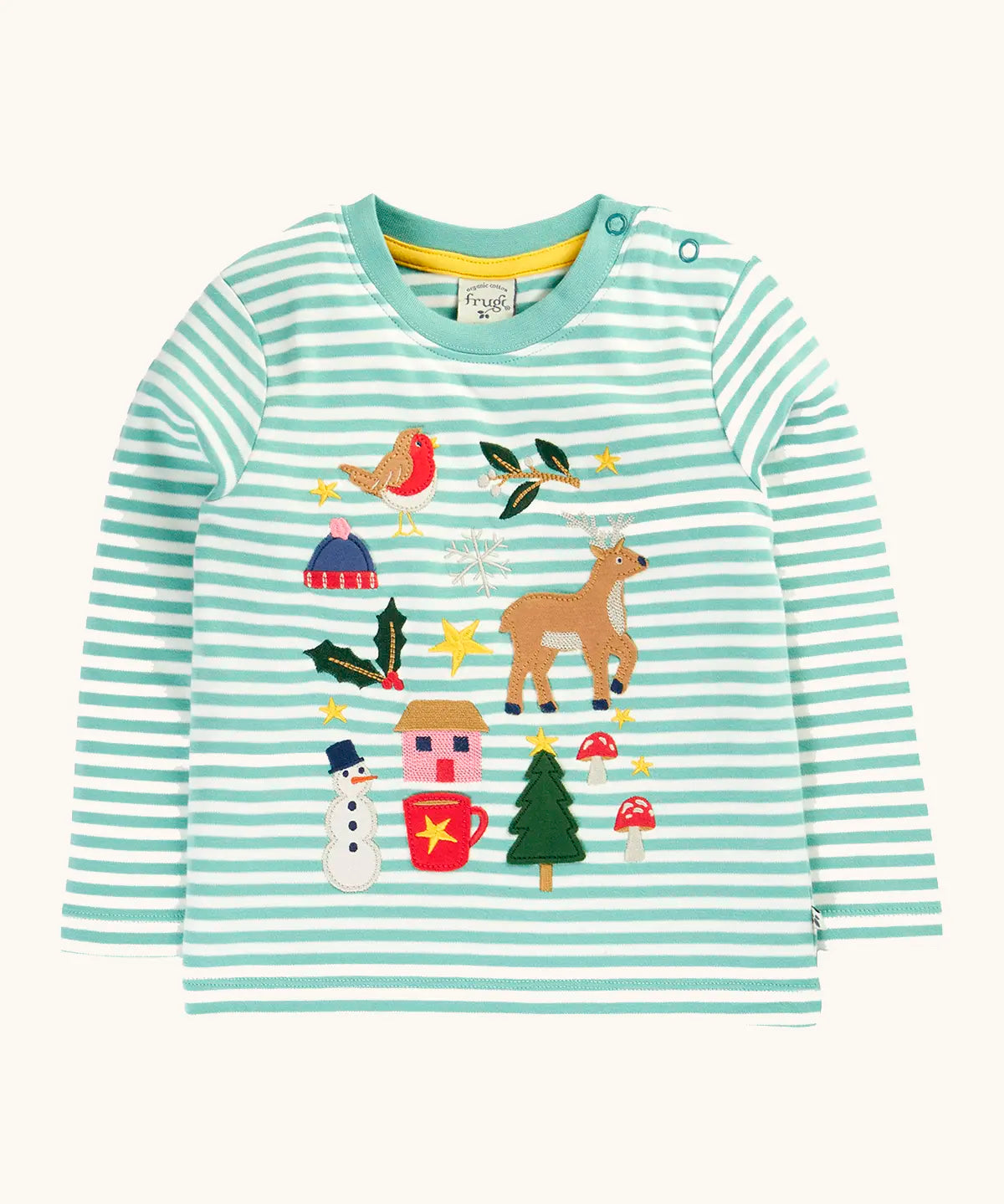 Frugi discovery organic cotton long sleeved top in miss green stripe with winter appliques. Robin, mistletoe, bobble hat, reindeer, holly, house, hot chocolate, snowman, tree, mushroom and stars. 