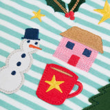 Close up of the snowman, holly tree house and hot chocolate appliques and embroidery details on the Frugi discovery organic cotton long sleeved top in miss green stripe with winter appliques.
