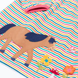 A close up of the horse applique on the front of the Frugi dolcie organic cotton child's dress. 