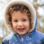 A child walking outside