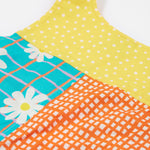 A close up of the back of the Frugi Summer Printed Dungaree in the Rainbow Hotchpotch print.