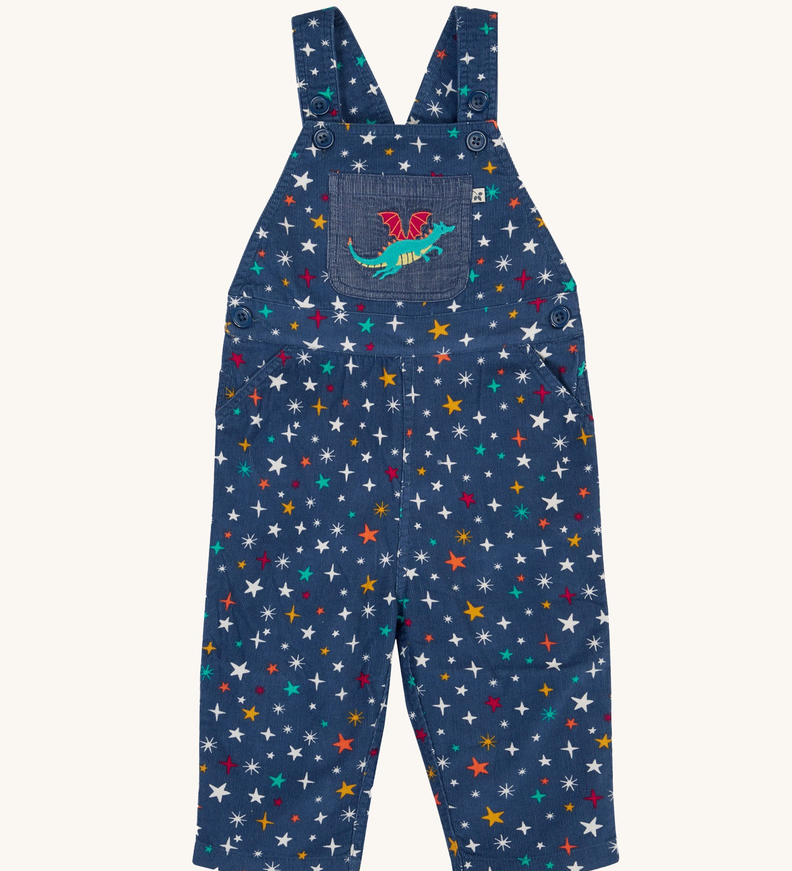 Frugi  Rainbow Galaxy Dragon Durgan Cotton Corduroy Dungarees. These navy cord dungarees have a rainbow coloured star print all over and a green dragon applique on the front pocket. These dungarees are part of a wide range of organic cotton clothing for children available here at Babipur. 