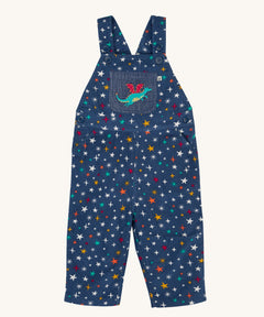 Frugi  Rainbow Galaxy Dragon Durgan Cotton Corduroy Dungarees. These navy cord dungarees have a rainbow coloured star print all over and a green dragon applique on the front pocket. These dungarees are part of a wide range of organic cotton clothing for children available here at Babipur. 