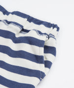 Close up of the shorts from the Frugi easy  on llama outfit showing the pocket detail and waist hem on blue and white stripe organic cotton fabric