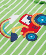 A close up of the Frugi kids breton easy on tractor jumper. Showing a red tractor applique and a rainbow embroidery on green and white stripe organic cotton fabric