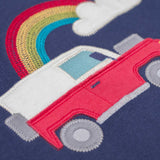 A close up of the red landy type vehicle applique on the front of the Frugi easy on organic cotton navy jumper.